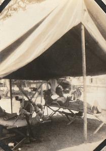 U.S. Marine relaxing in tent in Haiti