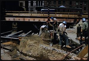 Workers at urban construction site, Boston