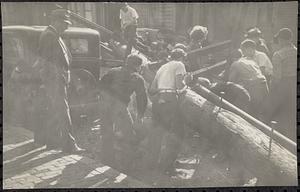 High tension! After the hurricane, boys help in the work of clearing poles and trees out of roads, East Boston