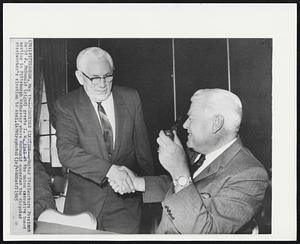 Concedes Election--United Steelworkers President David J. McDonald (right) greets I. W. Abel at the union executive board meeting in Pittsburgh Wednesday where McDonald conceded the disputed steelworker's election to Abel.