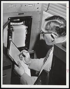 Hurricane Connie is a red line on wall map at Weather Bureau, Boston Airport. At right, chief meteorologist Oscar Tenenbaum makes recording at bureau's gust meter.