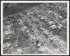 Tornado Area Starts Rebuilding. Ten days after last week's destructive tornado, here's an air view of the hard-hit Shrewsbury, Mass., area east of Worcester. Home in lower center has a new roof, as do several other homes in picture. Other homes were destroyed beyond repair. Picture also shows streets cleared of fallen trees, new telephone poles going up and (right center) a