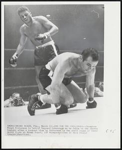 End for the Challenger--Champion Floyd Patterson is behind Ingemar Johansson as he falls to the canvas tonight after a kockout blow by Patterson in the sixth round of their title fight at Miami Beach.