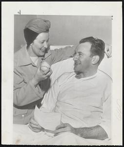 Talking About His Operation and feeling much better since the removal of his appendix in an Allentown, Pa. hospital, is Fred Schmidt, Cardinal pitcher. His wife brought along a baseball to help cheer the invalid.