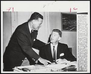 Southpaw Signature--General Manager Frank Lane of the Cleveland Indians aims a bent index finger at the 1958 contract between the baseball club and Pitcher Herb Score, 24-year-old strikeout king. Lane said the contract terms are the same as those Score agreed to a year ago. Chances are Herb would have come in for a fat raise had a line drive not injured his right eyes last May 7 and sidelined him for the remainder of the season.