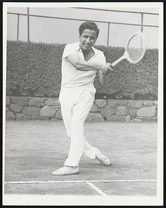 Two-Fisted Tennis New York - Here Segura follows through on a forehand shot, both hands still gripping the racket. Most of his shots are hit with two hands. He uses one hand when he needs the added stretch to hit a ball which is nearly out of reach.