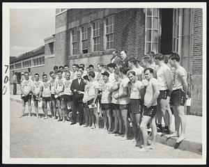 Training Completed-Mayor John B. Hynes (center) presents certicates to 37 lifeguards of the Boston park department upon completion of first water safety institute, sponsored by the Red Cross and Park Commr. Frank R. Kelley during past two weeks.