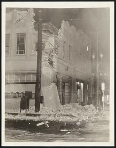 Quake Ravaged Building in Los Angeles -- Partially Wrecked Building at Corner of Compton and Seville Streets, Los Angeles, Calif., Pictured a Short Time After the Earthquake, March 10. A Building and Loan Company Occupied the Structure.