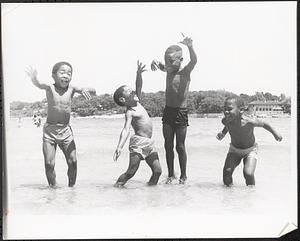 James, Ronald, Jarrod and Damion jumping at the beach