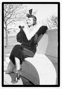 A model posing by the Oliver Wendall Holmes Memorial Sundial