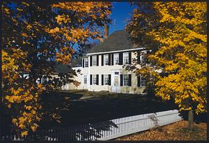 Autumn scene of yellow house