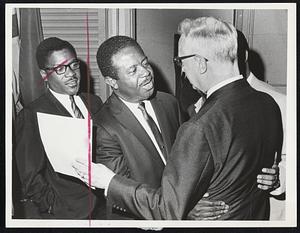 Rev. Ralph Abernathy embraces Dr. William H. Rhoades, executive secretary of the Bapt Home Mission Society, while Rev. Bernard Le special assistant to the leader of the Poor People March, looks on.