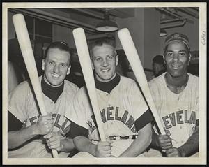 Bludgeons That Flailed the Sox- Indian homerun heroes, Ralph Kiner, Al Rosen and Al Smith (left to right), who beat Boston last night with circuit smashes, line up jubilantly with their war clubs in the post-game setting.