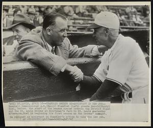 St. Louis – Chandler Greets Ex-Assistant in New Job – Baseball Commissioner A. B. (Happy) Chandler (left) greets Herold (Muddy) Ruel, before the start of the season opener between the Detroit Tiger and the St. Louis Browns at Sportsman's Park in St. Louis yesterday afternoon. Ruel is beginning his first season as the Brown’s manager. He resigned as assistant in Chandler’s office to take the new job.