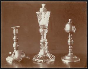 VIII. Whale-oil lamp with inverted bulbs, lamp on right having a candle-base; middle lamp have blown glass below. encircling [fray?] above.