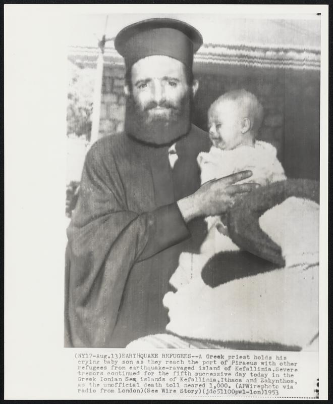 Earthquake Refugees-- A Greek priest holds his crying baby son as they reach the port of Piraeus with other refugees from earthquake-ravaged islands of Kefallinia. Severe tremors continued for the fifth successive day today in the Greek Ionian Sea islands of Kefallinia, Ithaca and Zakynthos, as the unofficial death toll neared 1,000.