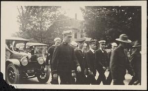 Sailors and a soldier parading