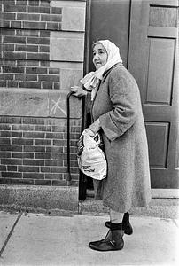 Lady with kerchief walking on Marlboro Street