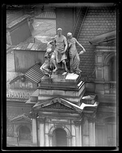 Sculpture on top of the old Boston US Post Office building by D. C. French titled "Labor Sustaining Art and the Family"