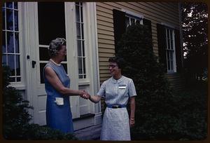 Women greeting each other on the bicentennial house tour