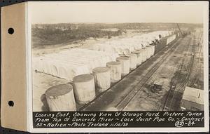 Contract No. 85, Manufacture and Delivery of Precast Concrete Steel Cylinder Pipe, Southborough, Framingham, Wayland, Natick, Weston, looking east showing view of storage yard, picture taken from top of concrete mixer, Natick, Mass., Nov. 10, 1939