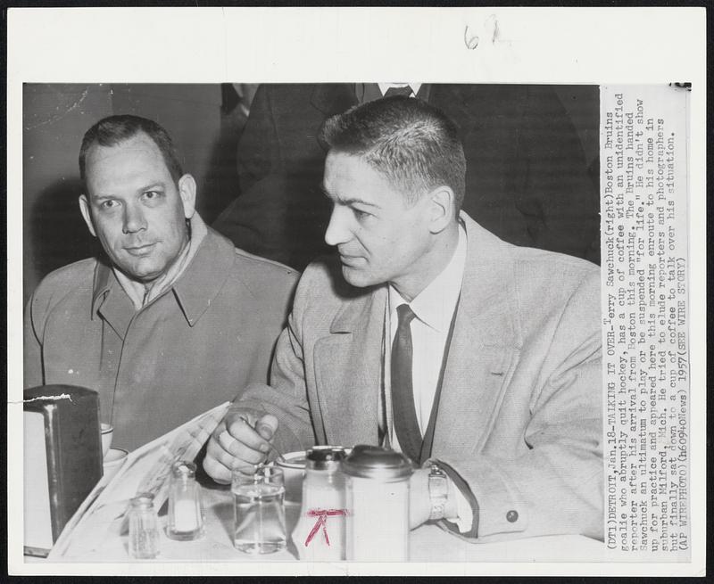 Talking It Over-Terry Sawchuck(right)Boston Bruins goalie who abruptly quit hockey, has a cup of coffee with an unidentified reporter after his arrival from Boston this morning. The Bruins handed Sawchuk an ultimatum to play or be suspended "for life." He didn't show up for practice and appeared here this morning enroute to his home in suburban Milford, Mich. He tried to elude reporters and photographers but finally sat down to a cup of coffee to talk over his situation.