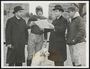 Time Out for Honors. Ernie Schwotzer, captain of the Boston College Eagles, receives a certificate naming him All-American All-Catholic guard Dec. 16 at Newton, Mass B.C., plays Clemson College in the Cotton Bowl at Dallas, Tex. Jan. 1. (l-r)- Rev. Patrick H. Collins, faculty director of athletics; Capt. Schwotzer; Rev. George M. Dowd, director diocesan catholic youth organization and head coach Frank Leahy.