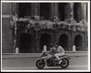 Two people on a motorcycle