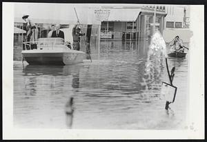 Florida Gov. Farris Bryant tours downtown section of Live Oak, Fla., where flood waters caused by hurricane Dora continue to rise.