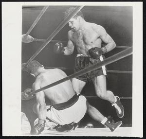 The Champ Makes a Boo Boo--Rocky Marciano grabs for ropes after slipping and falling as he missed wild swing in 10th round of bout against Roland LaStarza at New York's Polo Grounds.
