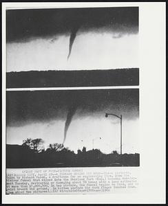 Kansas City – A Tornado Begins and Ends – These pictures, taken by Richard Mason, A draftsman for an engineering firm, show the vicious funnel that dipped into the Overland Park (Kan.) housing development Tuesday, destroying or damaging about 50 homes with a loss estimated at more than $1,000,000. In top picture, the funnel begins to form, and to point towards the ground. In bottom picture the dark finger touches down.
