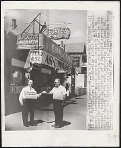 This Picketing Business, All in the Family--Leo P. Garabedian (left) of 2 Bancroft street, bartender eight years at George's Cafe on Chandler street, gets served a cup of coffee by his brother, Ralph Garabedian of 3 Mayfield street--one of the owners of the cafe employing Leo. Local 95, AFL Hotel and Bartenders Union, is picketing six spots in the city.