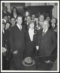 Maaurice Tobin and his wife, Helen stand with a large group of people