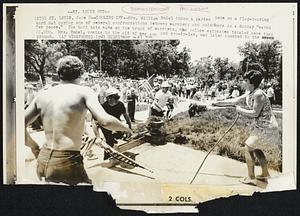 Cooling Off-- Mrs. William Hodel turns a garden hose on a flag-bearing hard hat during one of several confrontations between marchers and onlookers in a Sunday "march for peace." The hard hats made up the brunt of marchers, who police estimated totaled more than 20,000. Mrs. Hodel, coming to the aid of her sin and son-in-law, was later knocked to the ground.