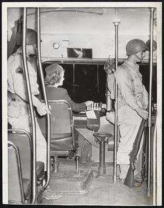 First Lady - This operator was the first woman to take out a trolley for a run in the Frankford section of Philadelphia when transit service was resumed yesterday. Armed [illegible] were stationed on all street cars, buses and elevated trains.