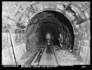 Weston Aqueduct, Section 13, concrete lining and excavation in tunnel through rock, station 584+30, looking east, Weston, Mass., Mar. 18, 1903
