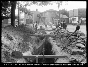 Distribution Department, Southern High Service Pipe Lines, Section 43, laying 24-inch pipe at Washington and River Streets, Dorchester, Mass., Jun. 23, 1915