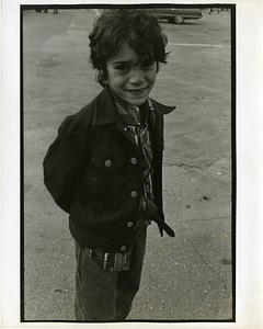 Portrait of a young boy in a parking lot