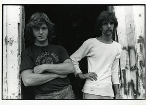 Portrait of two men posing in a doorway, Jefferson Park Housing Project, Cambridge, Mass 1974