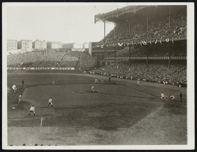 The Bases Full and Lazzeri up: Guy Bush, the Chicago pitcher, found this embarrassing situation confronting home in the sixth inning of the first World Series Game in New York City September 28. He walked Swell, Ruth, and Gehrig, who are shown on base. Lazzerri is up. Bush was taken out in this inning, Grimes replacing.