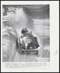 Hit the Wall--Two man driver Fred Fortune and brakeman Dick Davies get shaken up as their sled strikes the ice wall coming out of Zag during North American two-man races today. Fortune regained control and made the bottom safely.