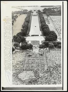 Celebrants-- Honor America Day participants watch an entertainment program tonight on stage set up on Washington Monument grounds, This view, from the top of the 550-foot monument, look west toward the Lincoln Memorial where a service earlier began the day's festivities. Circular open area, bottom, is where demonstrators overturned a concession truck.