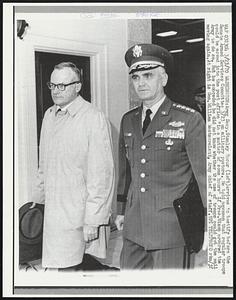 Army Secy. Stanley Resor (left) arrives to testify before the Senate Armed Services Committee 3/23 on military posture. He told newsmen that regular troops could be moved into the post office "in a matter of some hours" if Pres. Nixon ordered the Army to do so. But he conceded he did not know whether the use of troops could get the mail moving again. At right is Gen. William Westmoreland, Army chief of staff.