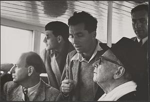 Serge Koussevitzky looking up, four unidentified men around him