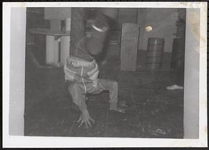 Young man breakdancing