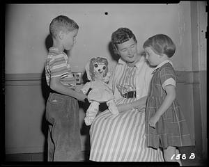 Showing children a doll
