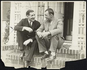 Gentlemen Jim Corbett (left), former world heavyweight champion, and Jack Sharkey, chatting on the doorstep of Sharkey's home at Chestnut Hill.