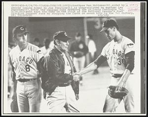 (Cards-Cubs) St. Louis: Southpaw Ken Holtzman (R), aided by a second inning homer by Joe Pepitone (L), is congratulated by manager Leo Curocher (C), after the Chicago Cubs defeated the St. Louis Cardinals 7-1, 9/24. Holtzman kept the Cubs in the thick of the National League’s East Division pennant race by stopping the Cards on seven hits in the 7-1 victory.