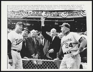 Metropolitan Stadium: Vice President Hubert Humphrey gets advice on how to toss out game’s 1st ball here 10/6 from rival Managers Sam Mele, Twins (L), and Walt Alston, Dodgers (R). Also on hand for first game of 1965 World Series are Baseball Commissioner Ford Frick (hatless) & Cal Griffith (2nd from L) Twins president.
