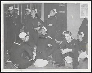 Marooned at the South Station-Coast Guardsmen headed for Detroit and discharge sit out the strike at the entrance